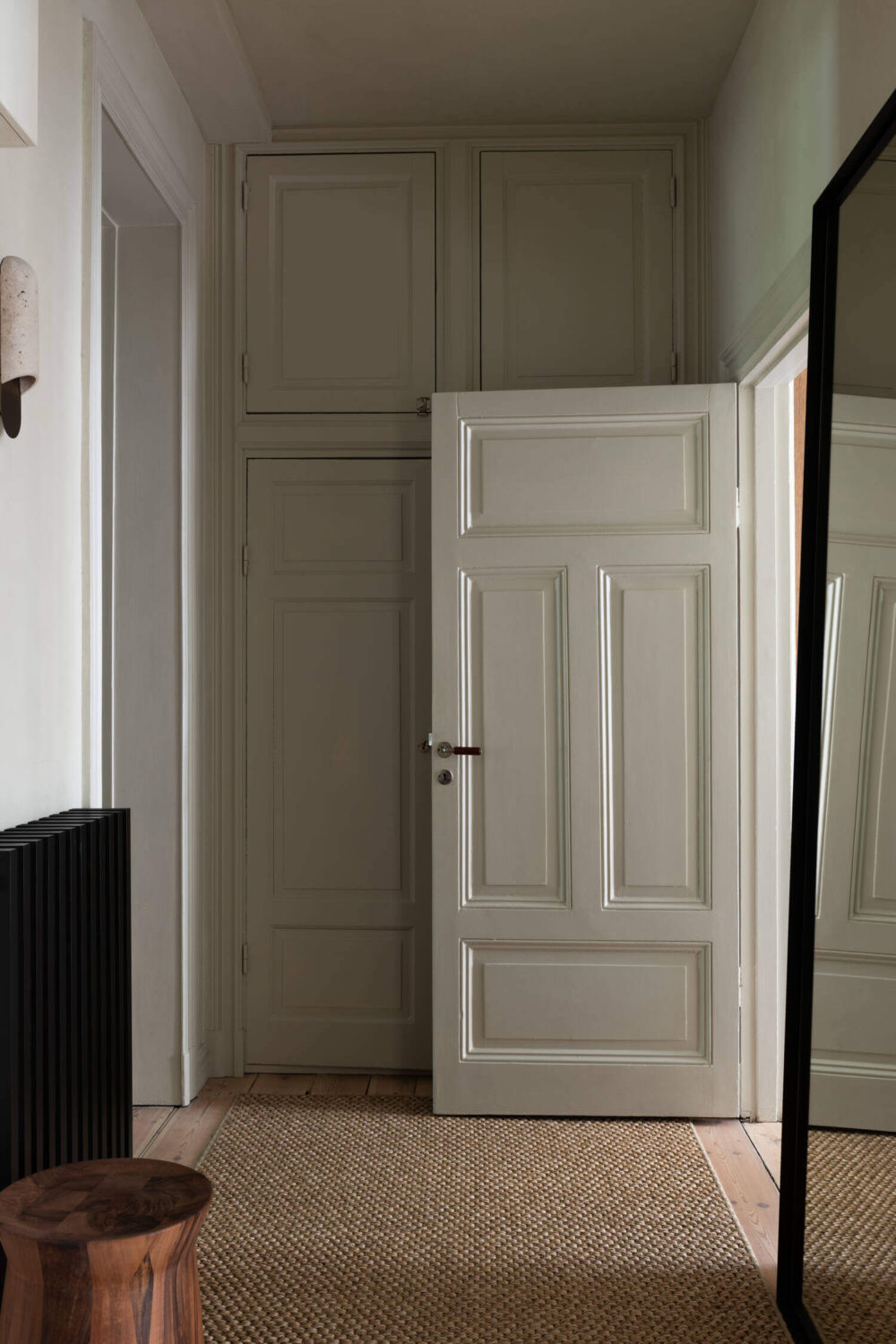 Japandi Interior Design in a Small Nordic Home 16 hallway-jute-rug-built-in-cabinets-nordroom