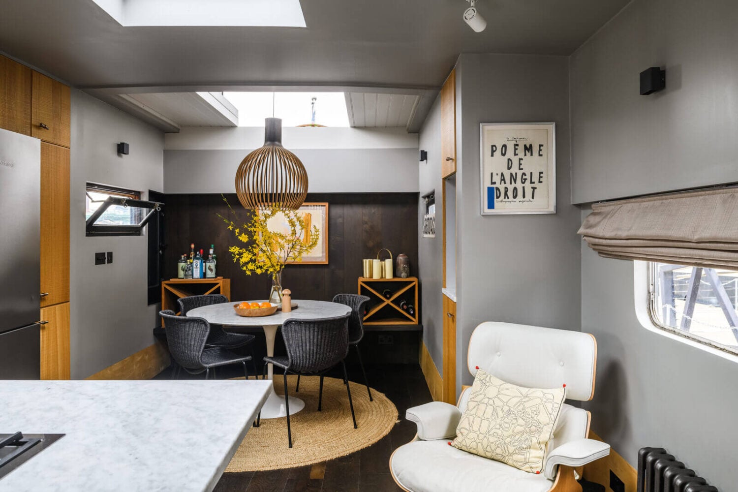 A Houseboat in London Fit For A Family 6 houseboat-kitchen-light-gray-walls-round-dining-table-nordroom