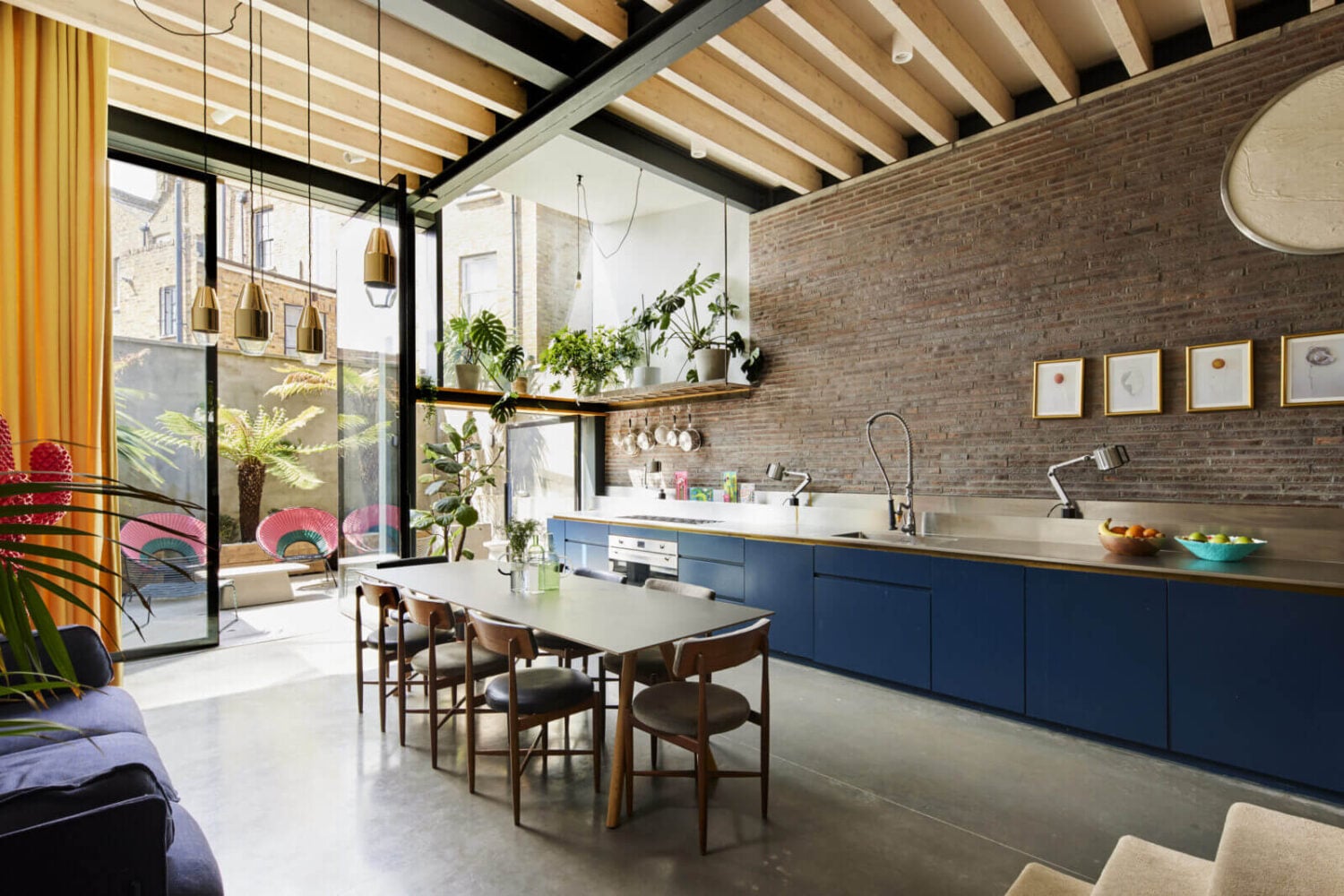 The Makers House: A Modern Achitectural Home in London 5 kitchen-blue-cabinets-brick-wall-dining-table-high-ceilings-nordroom