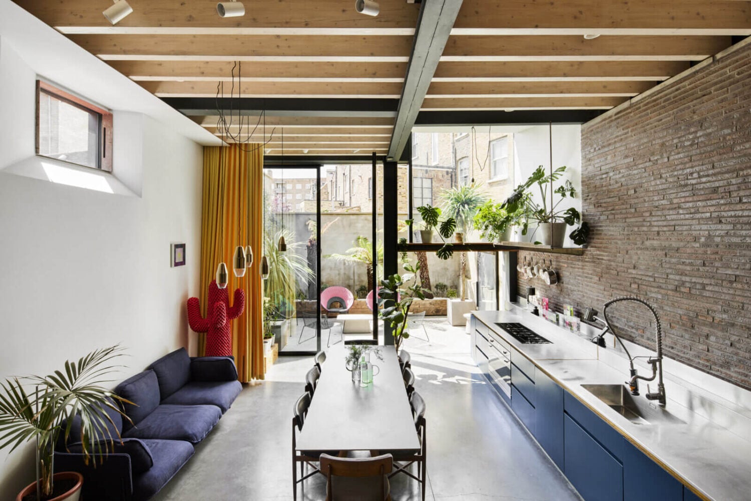 The Makers House: A Modern Achitectural Home in London 4 kitchen-brick-wall-wooden-ceiling-blue-cabinets-nordroom