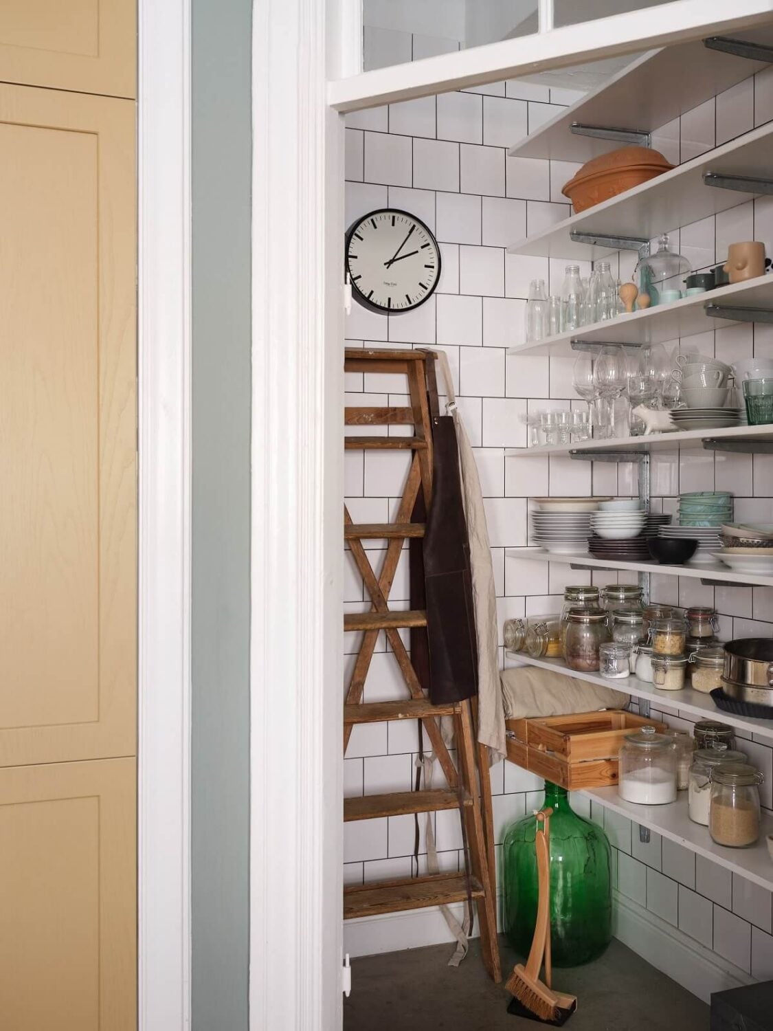 A Light Nordic Home with Ochre Yellow Kitchen 13 kitchen-pantry-white-tiles-open-shelves-nordroom