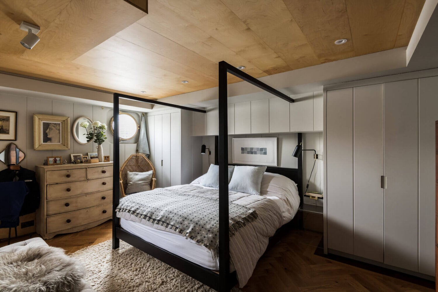 A Houseboat in London Fit For A Family 11 light-gray-bedroom-canopy-bed-round-window-houseboat-london-nordroom