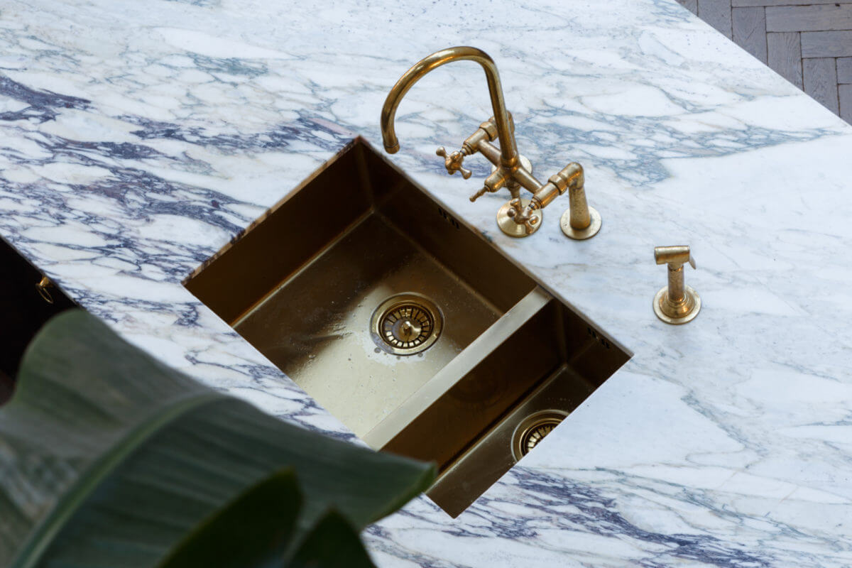 A Georgian Home with Floral Vintage-Style Bathroom 5 marble-kitchen-island-brass-sink-nordroom