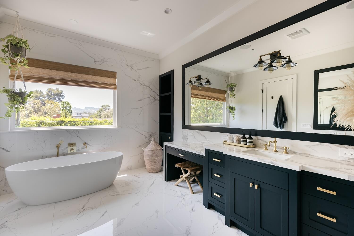 The Los Angeles Home of Emmy Raver-Lampman and Daveed Diggs 20 master-bathroom-blue-vanity-freestanding-bath-daveed-diggs-emmy-raver-lampman-nordroom