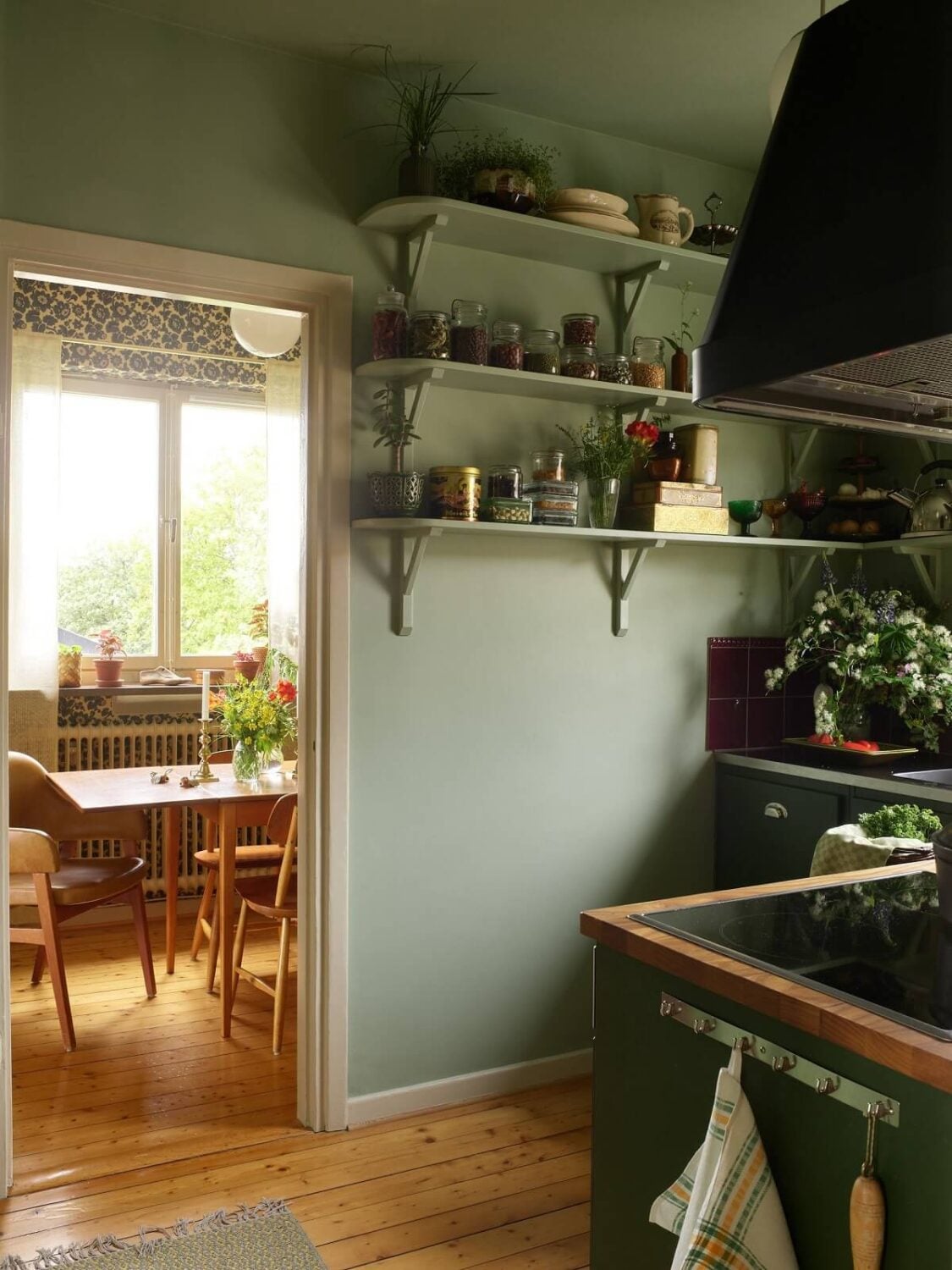 Midcentury Furniture in a Pink and Green Home 5 open-shelves-green-kitchen-nordroom
