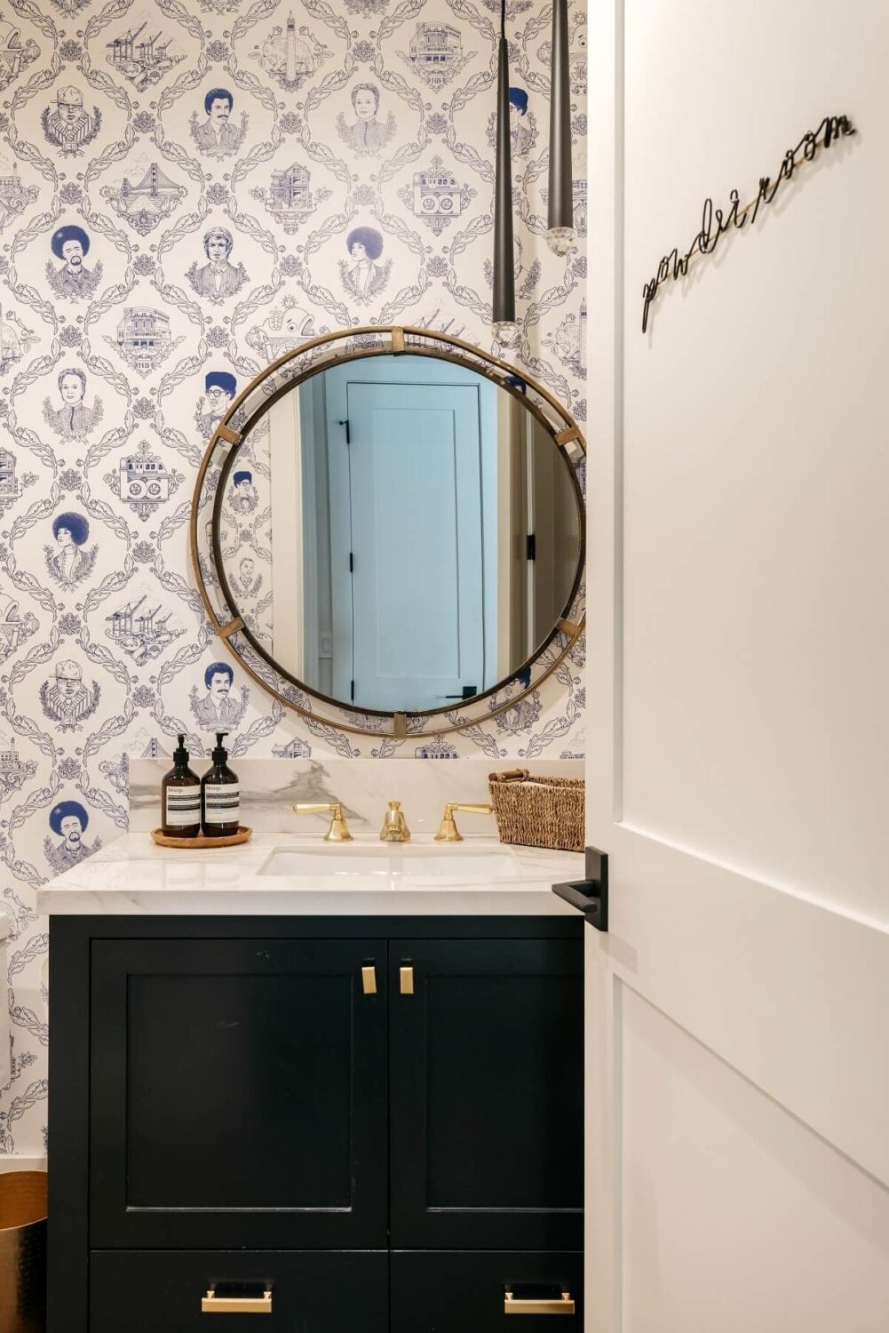The Los Angeles Home of Emmy Raver-Lampman and Daveed Diggs 15 powder-room-round-mirror-daveed-diggs-emmy-raver-lampman-nordroom
