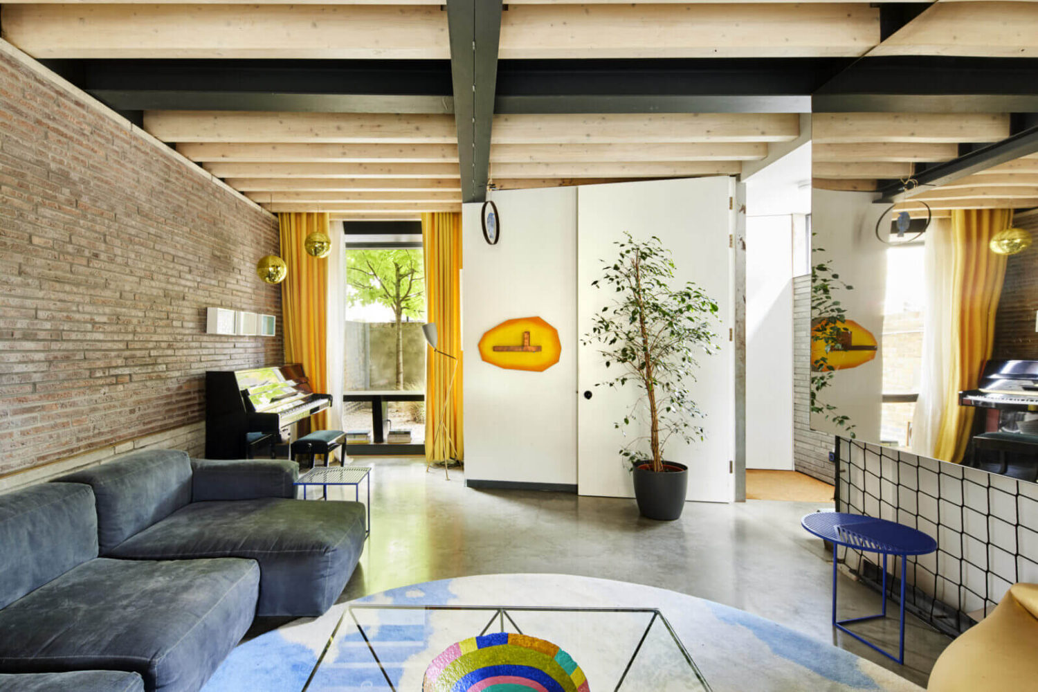 The Makers House: A Modern Achitectural Home in London 13 sitting-room-blue-sofa-yellow-curtains-nordroom