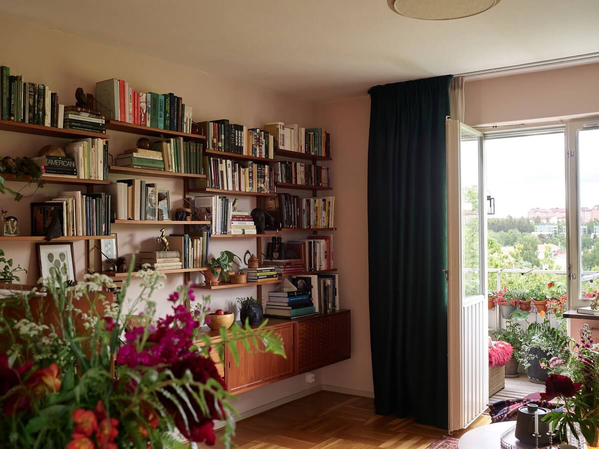 Midcentury Furniture in a Pink and Green Home 11 sitting room bookshelves pink ground farrow ball nordroom Midcentury Furniture in a Pink and Green Home