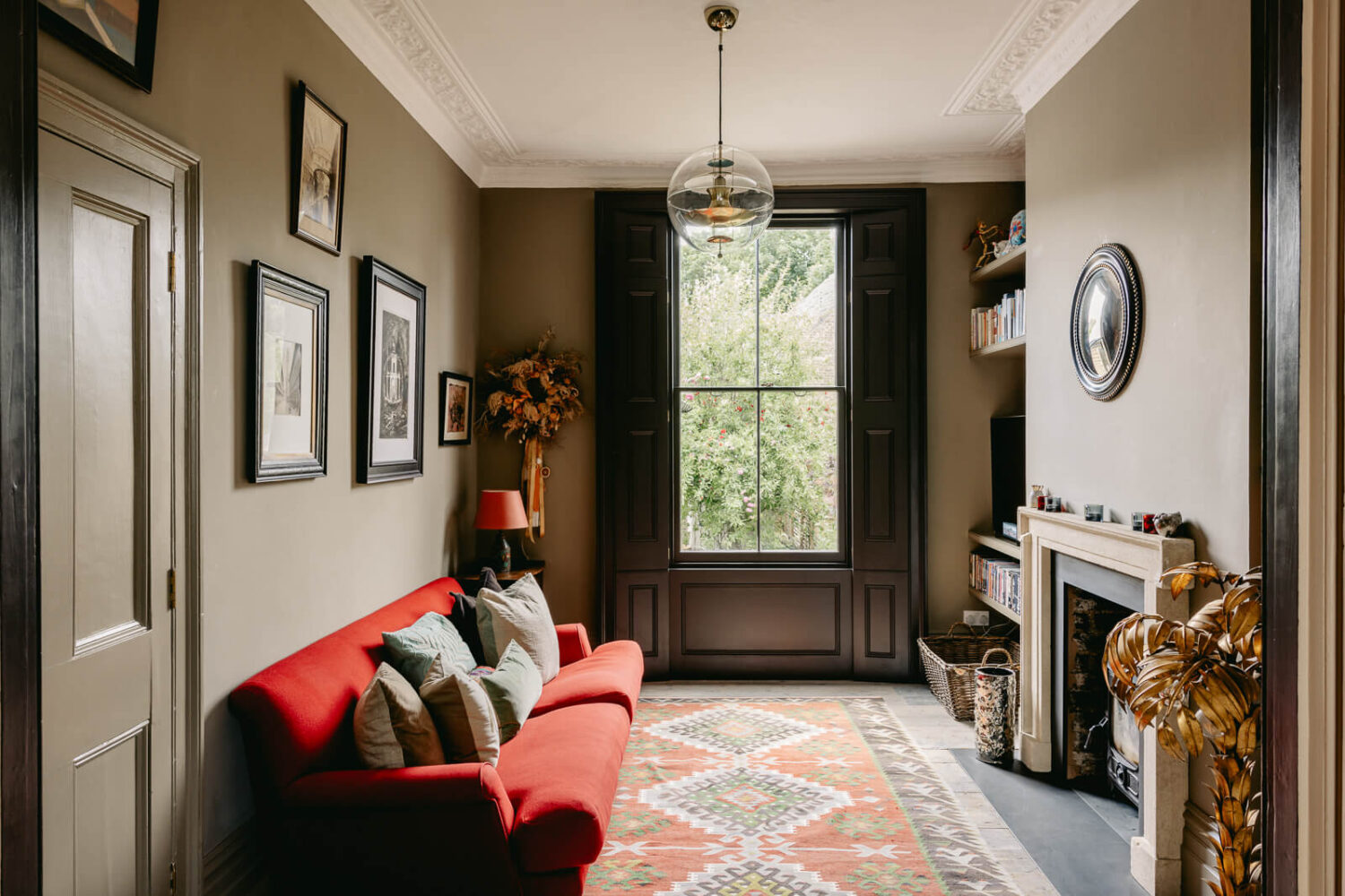A Carefully Restored Victorian House in London 5 sitting-room-fireplace-red-sofa-nordroom