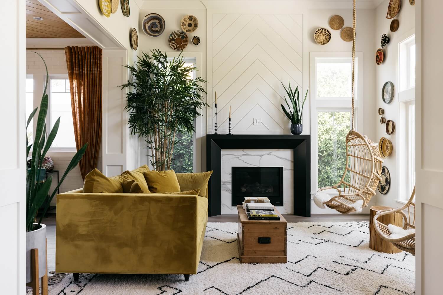 The Los Angeles Home of Emmy Raver-Lampman and Daveed Diggs 1 sitting-room-ochre-yellow-velvet-sofa-fireplace-daveed-diggs-emmy-raver-lampman-nordroom