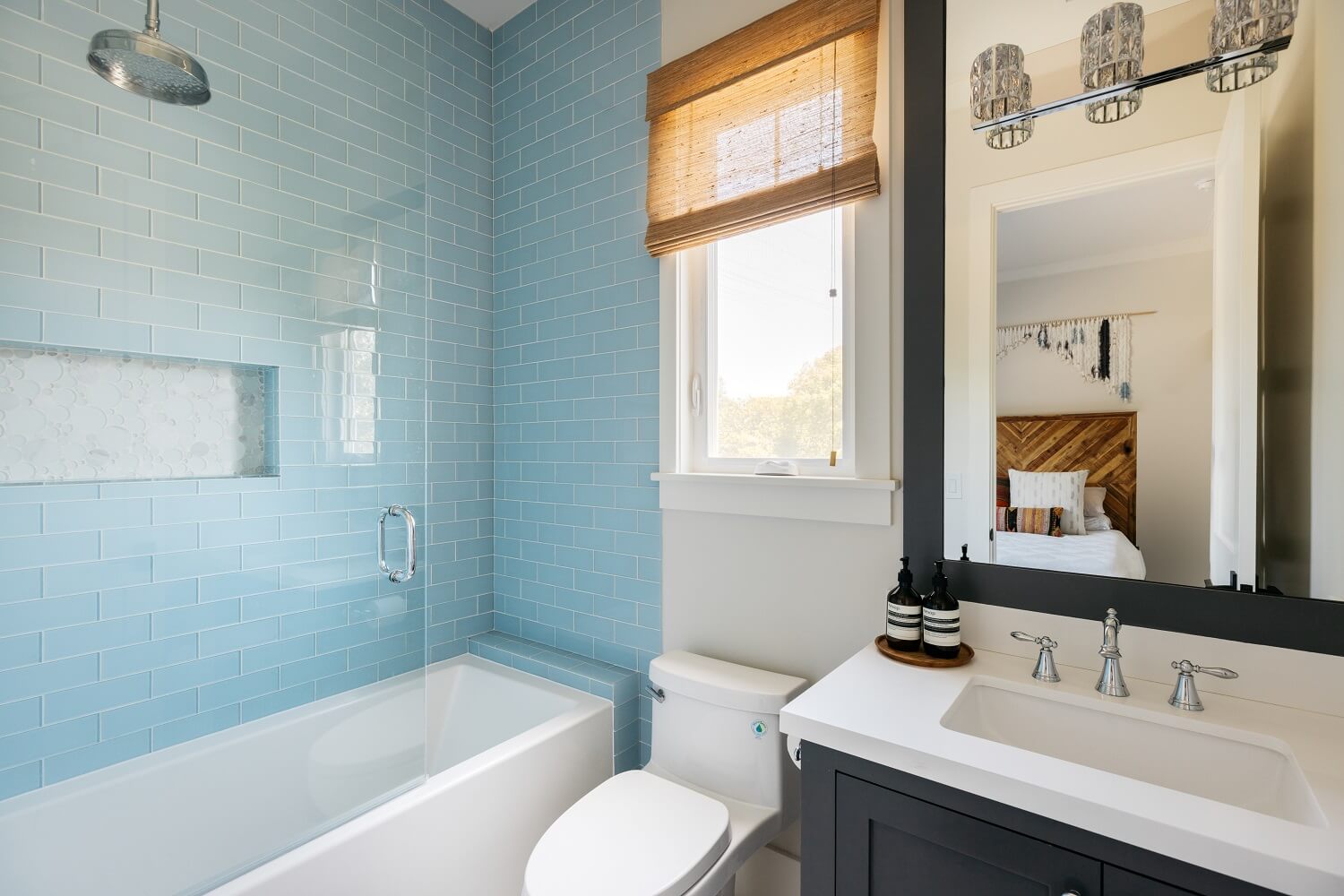 The Los Angeles Home of Emmy Raver-Lampman and Daveed Diggs 23 small-bathroom-tub-blue-tiles-daveed-diggs-emmy-raver-lampman-nordroom