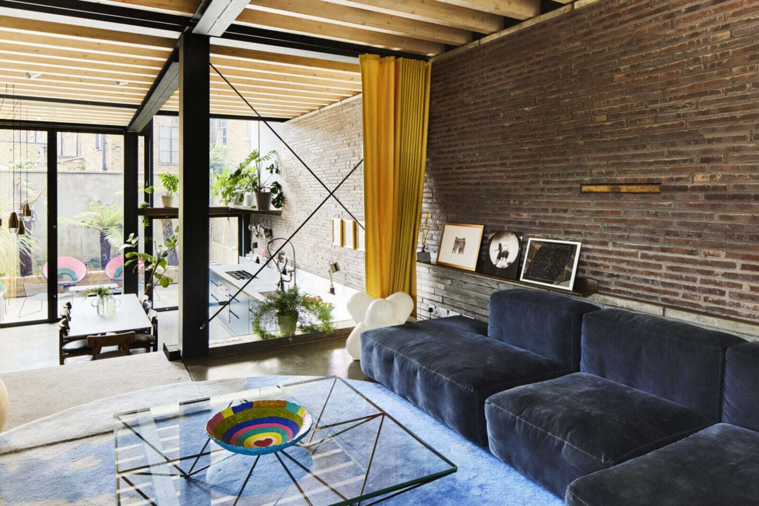 The Makers House: A Modern Achitectural Home in London 12 split-level-living-room-blue-sofa-brick-wall-nordroom