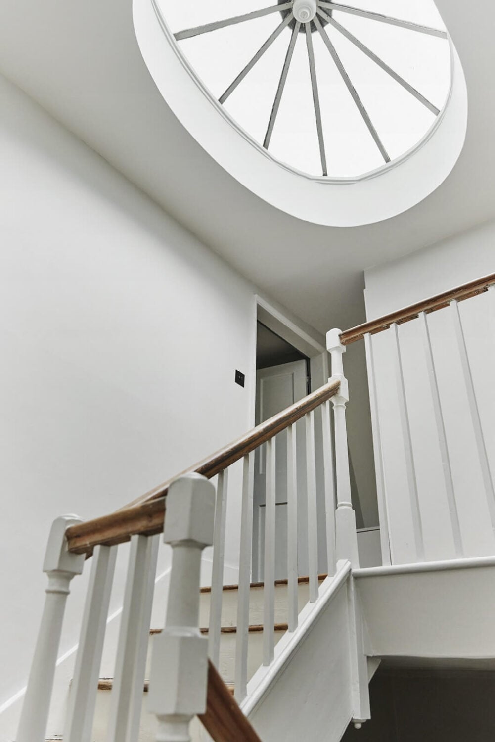 This Georgian Home in London Uses Blue as Accent Color 17 staircase-georgian-home-skylight-nordroom
