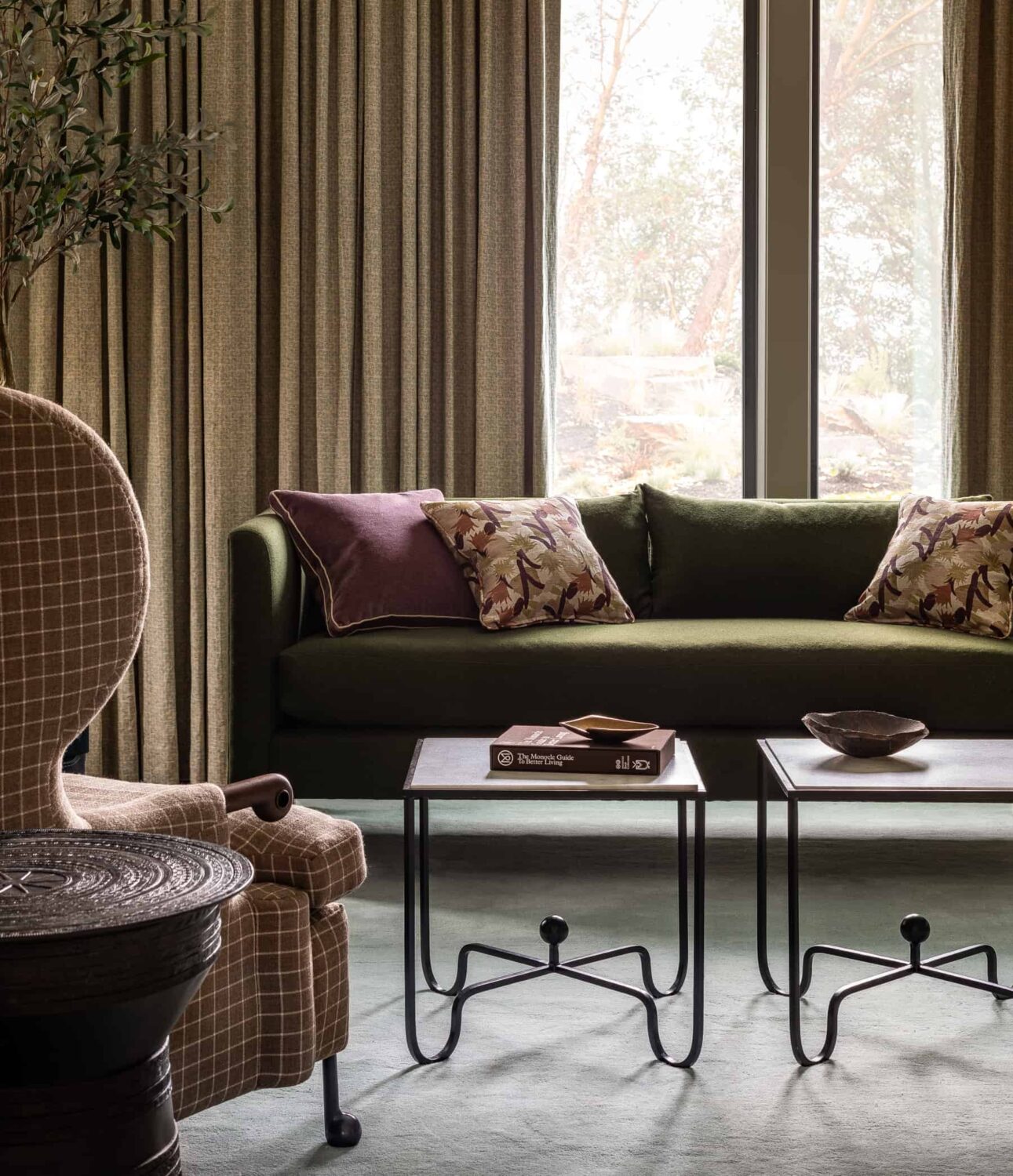 A Warm Family Home on Fox Island 19 Heidi-Caillier-Design-luxury-interior-designer-primary-bedroom-seating-area-green-sofa