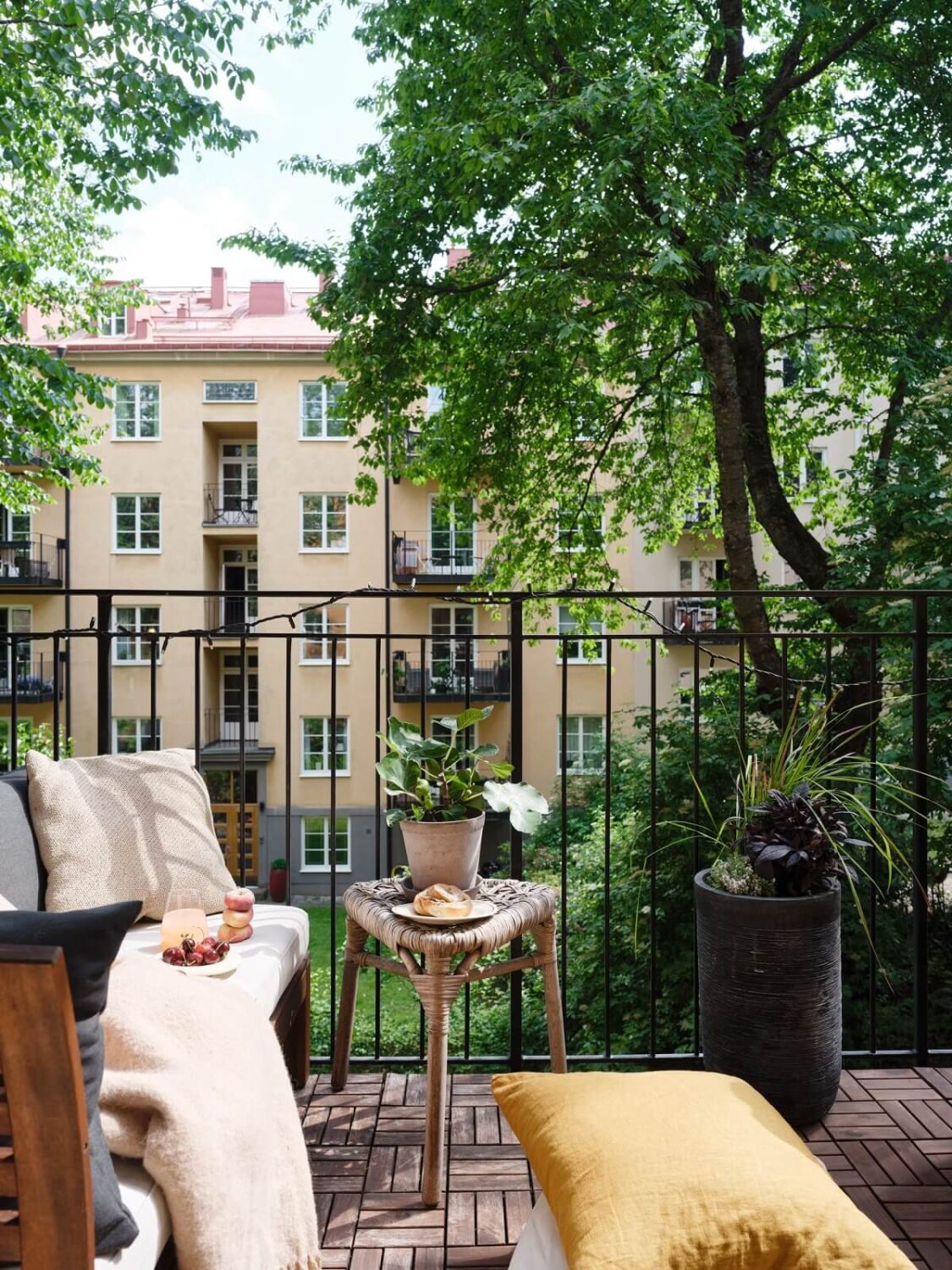 A Light Pink and Gray Nordic Home 26 balcony-overlooking-green-courtyard-nordroom