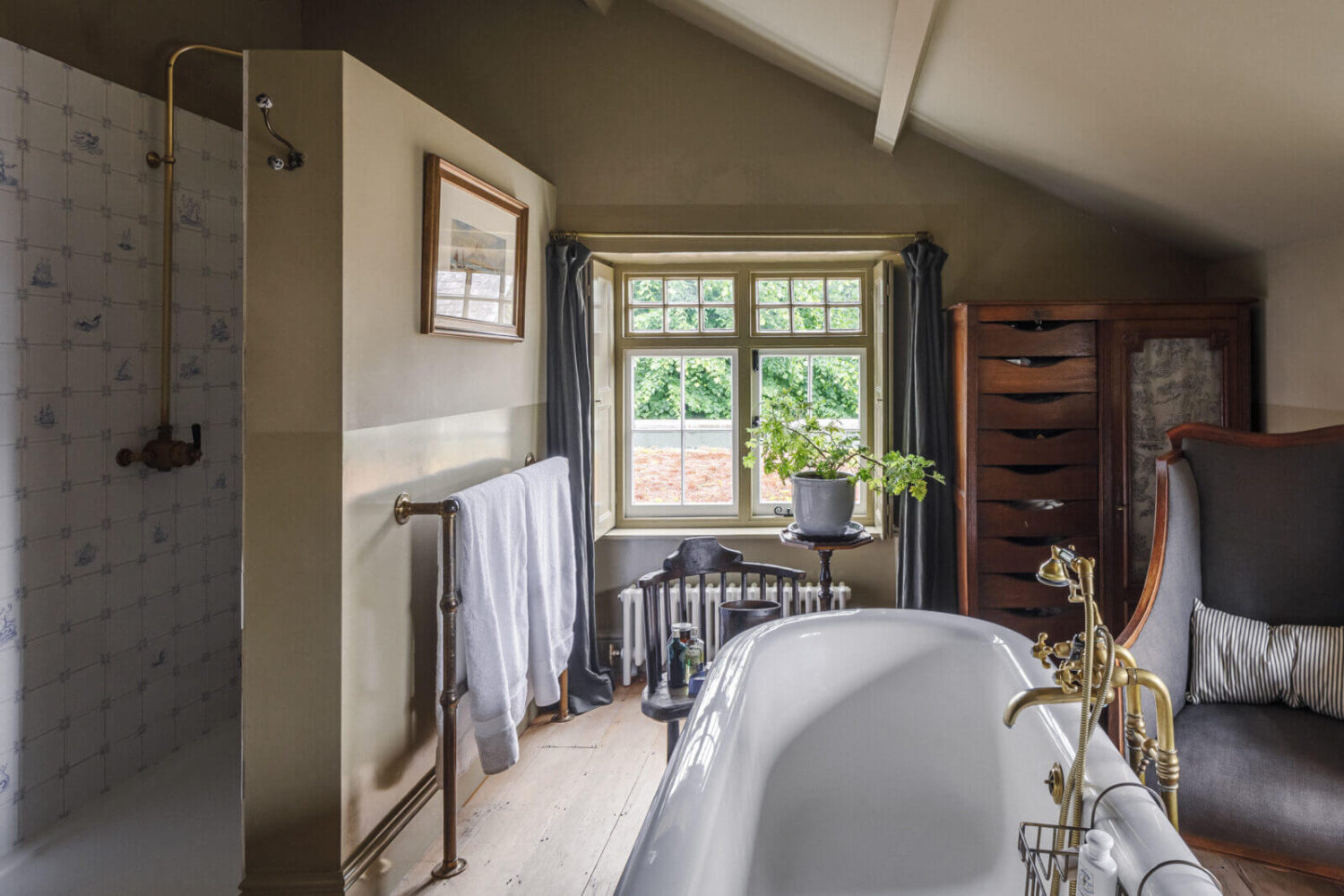A Cozy Restored Country House in England 19 bathroom-freestanding-bath-walk-in-showert-sloped-ceiling-nordroom