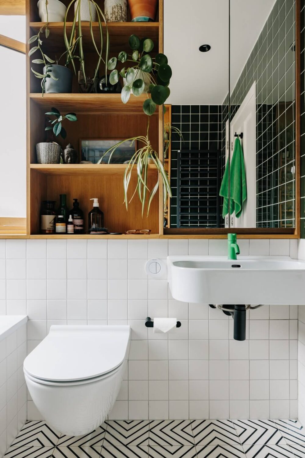 Inspiring Bathrooms With Geometric Tiles 20 bathroom-green-tiles-built-in-cabinet-above-toilet-nordroom
