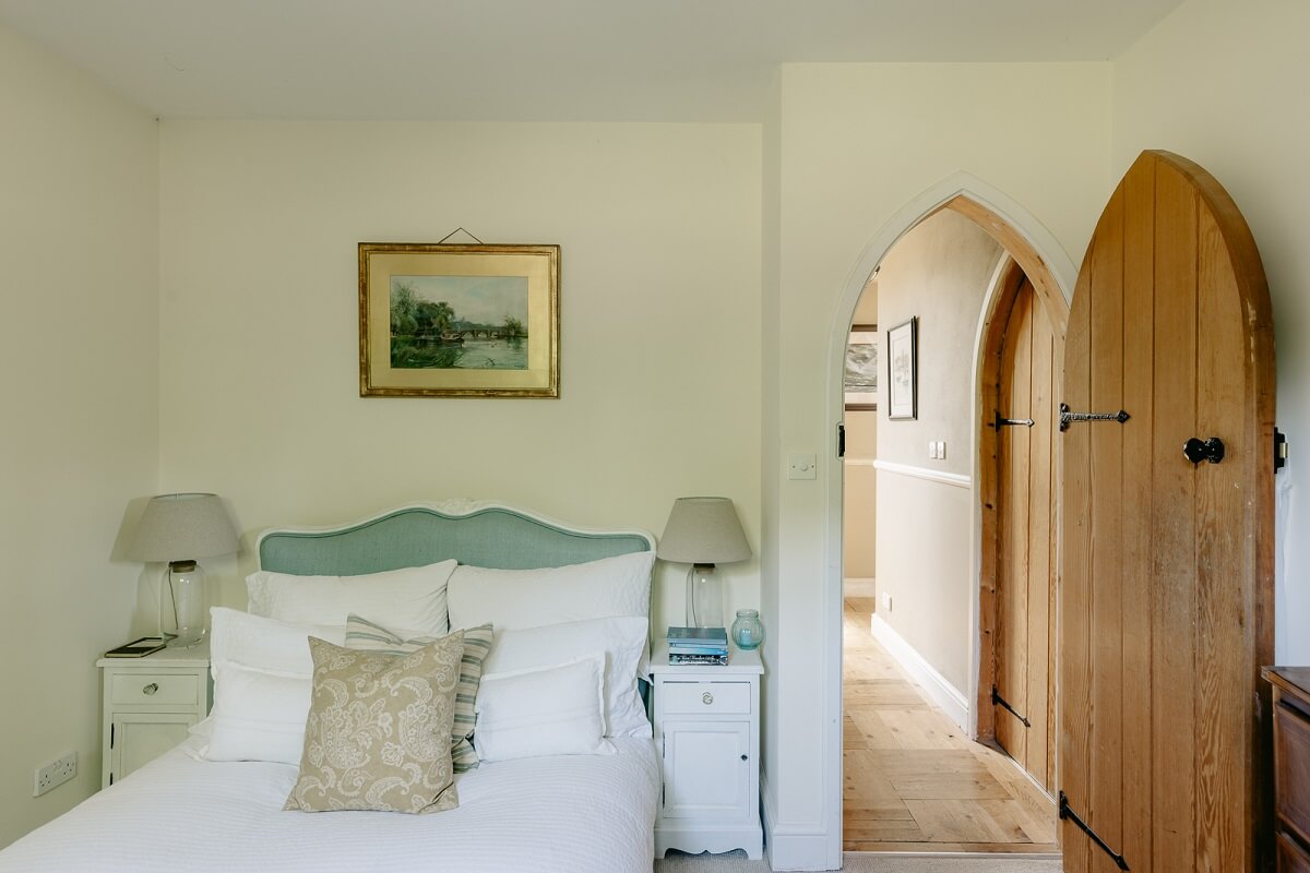 A Warm Church Conversion in England 16 bedroom-arched-wooden-door-church-conversion-nordroom