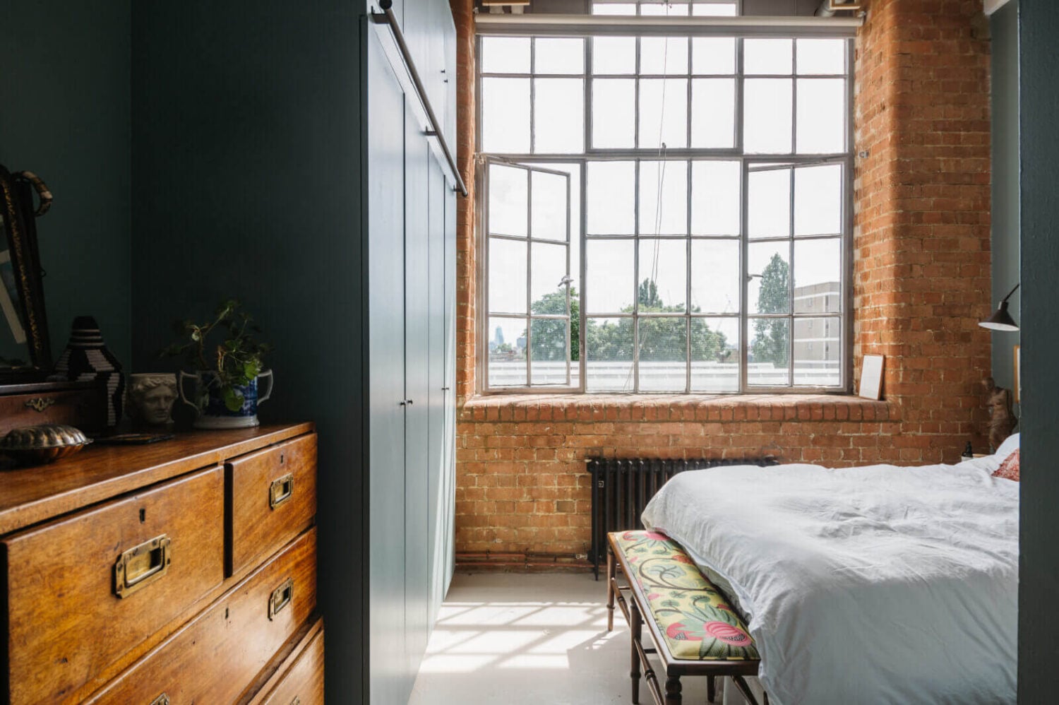 A Loft-Style Apartment with Brick Walls in London 14 bedroom-brick-walls-industrial-windows-blue-walls-built-in-wardrobes-nordroom