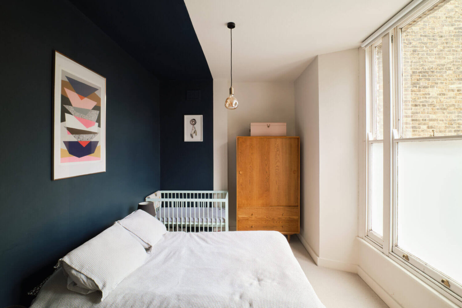 A Pink and Blue London Apartment 9 bedroom-dark-blue-accent-wall-nordroom