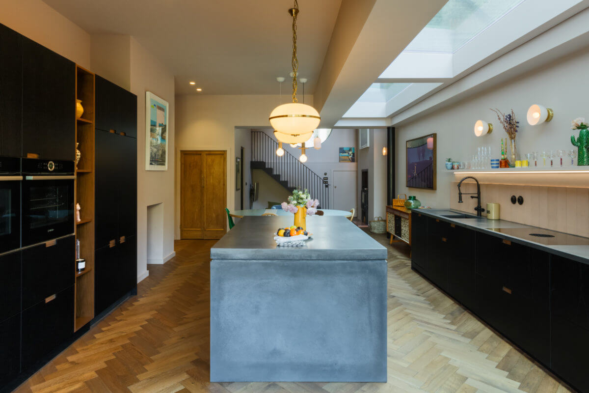 A Combination of Styles and Color in a London Townhouse 2 black-kitchen-cabinets-skylight-wooden-floor-nordroom
