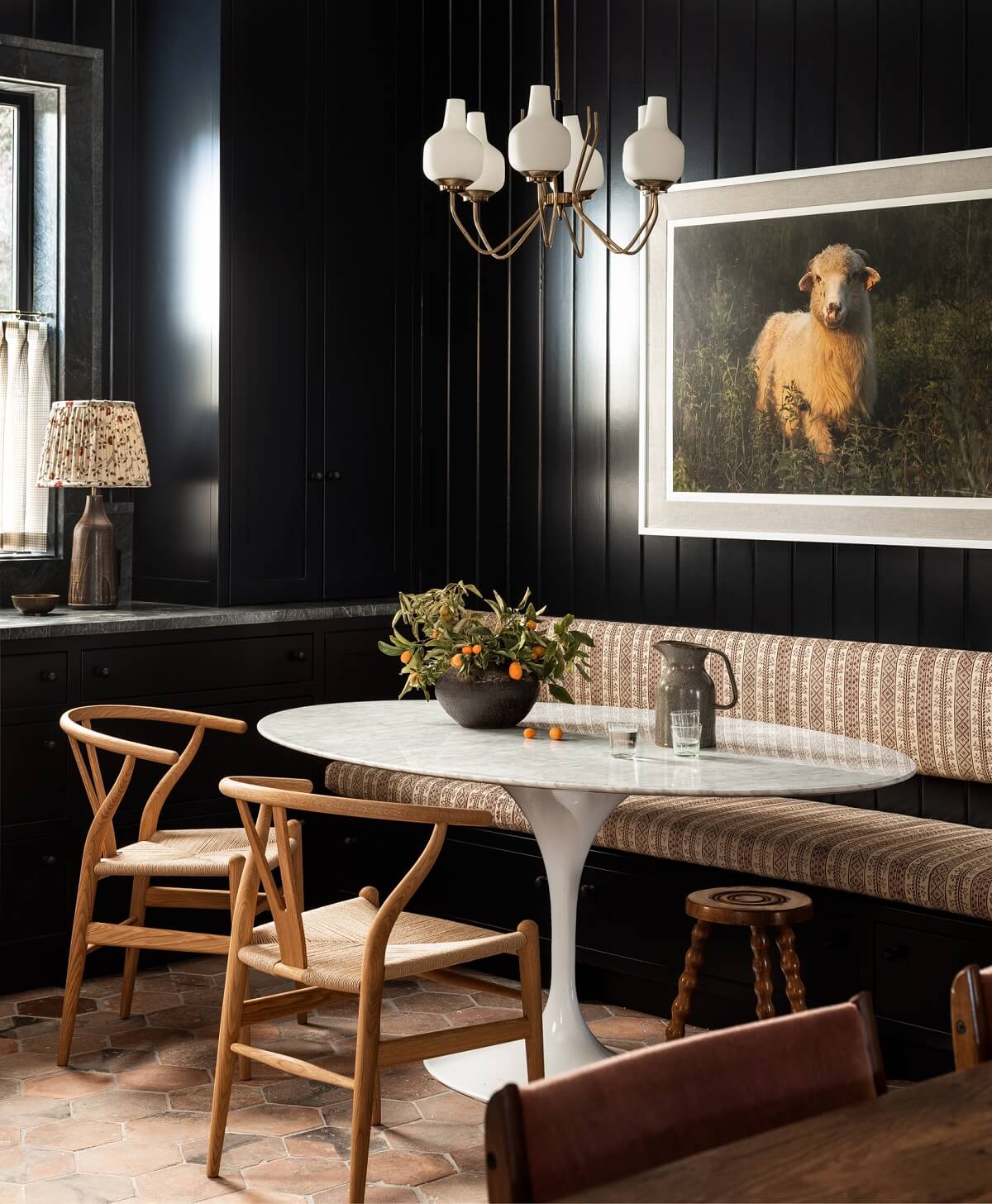 Pink Tones and Black in a Stunning Fox Island Home 7 breakfast-nook-black-walls-oval-table-wishbone-chairs-nordroom