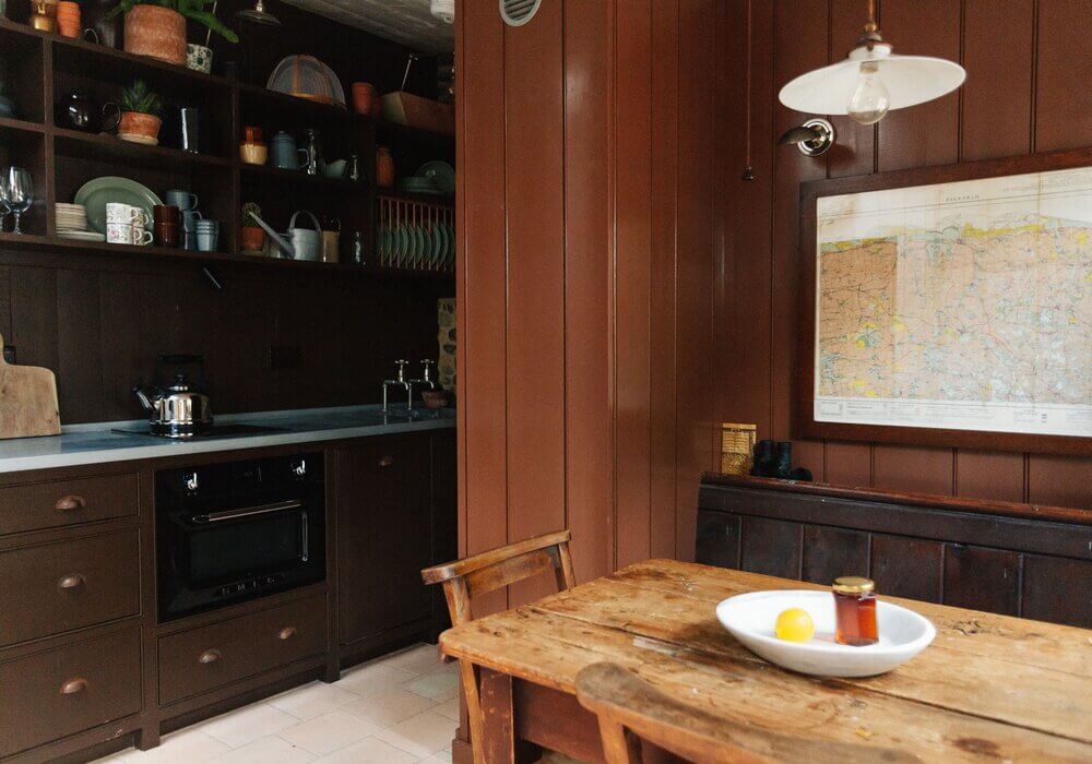 Spinks Nest: A Small Vintage Cottage in England 2 brown-cottage-kitchen-open-cabinets-nordroom