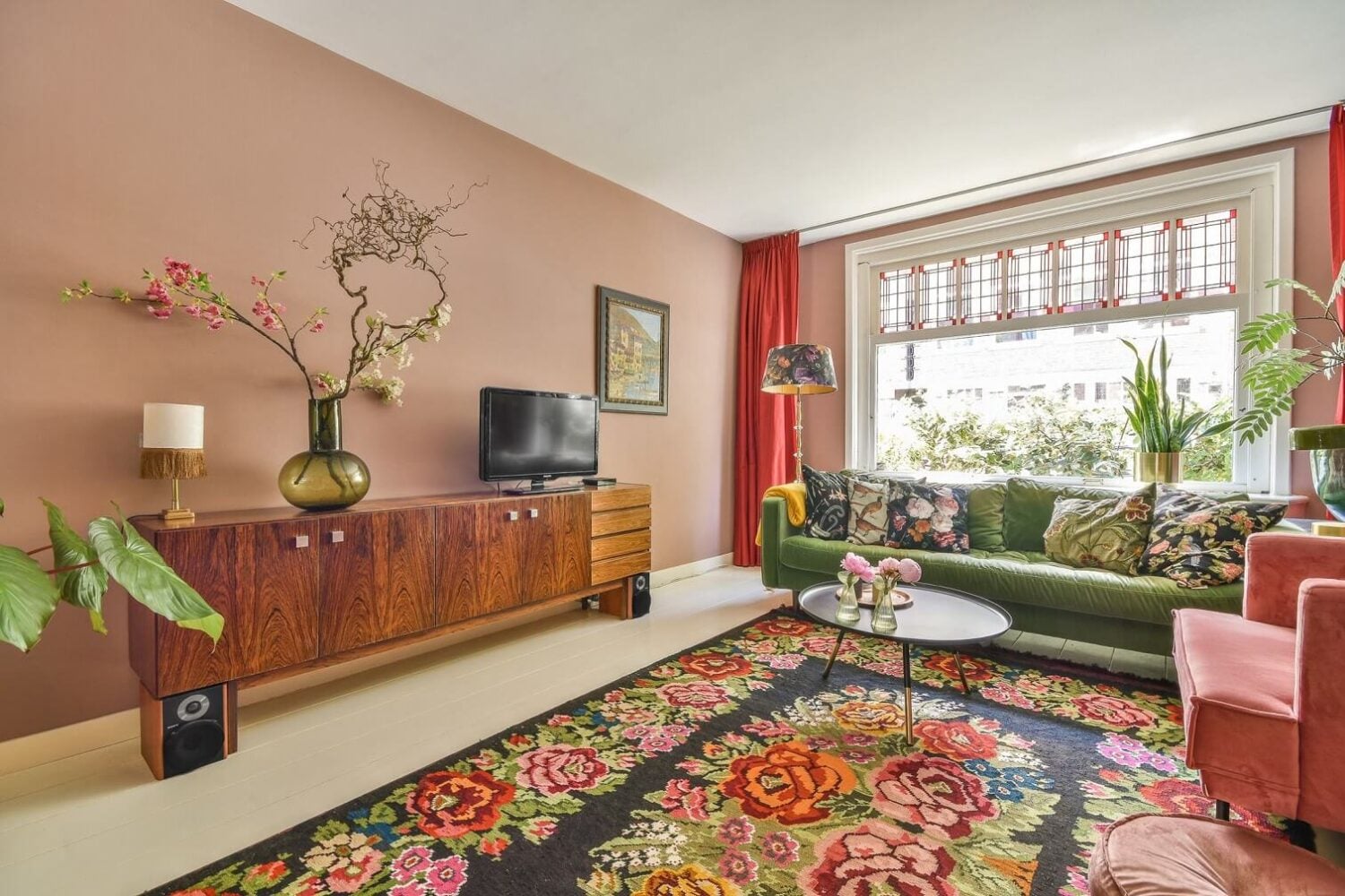 A Bright Colorful Home in Amsterdam 2 colorul-sitting-room-pink-walls-green-sofa-nordroom