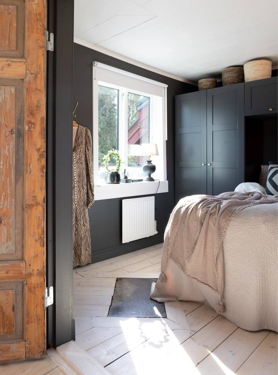 A Monochrome Nordic Home with Cozy Courtyard 10 dark-gray-bedroom-built-in-wardrobes-rustic-wooden-doors-nordroom