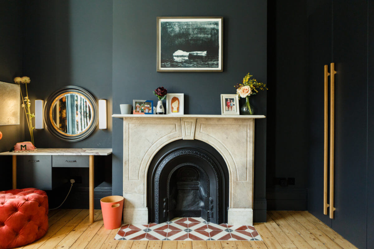 A Combination of Styles and Color in a London Townhouse 20 fireplace-dark-blue-master-bedroom-nordroom