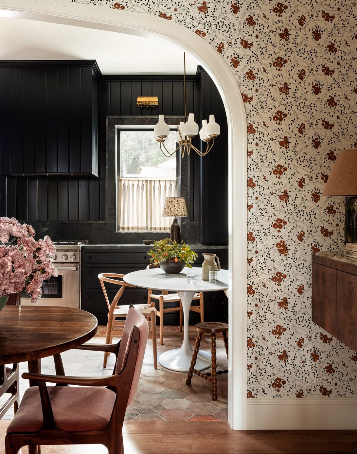 Pink Tones and Black in a Stunning Fox Island Home 6 floral-wallpaper-dining-room-arch-doorway-black-kitchen-nordroom