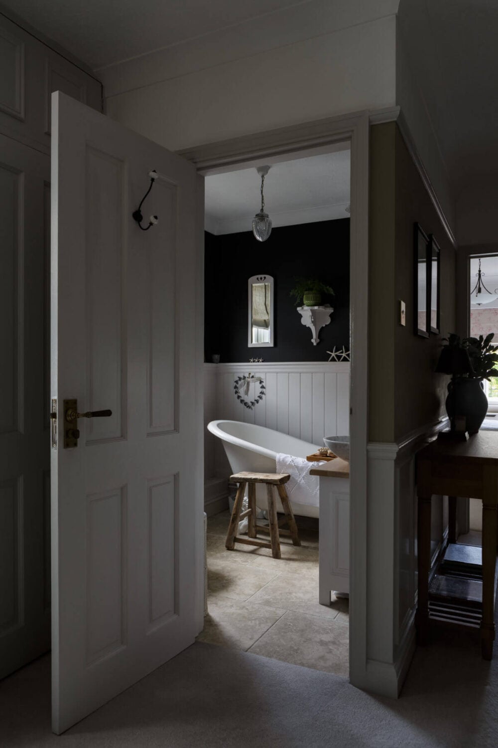 A Cozy Cottage-Style Country House with a Lovely Garden 19 freestanding-bath-black-walls-nordroom
