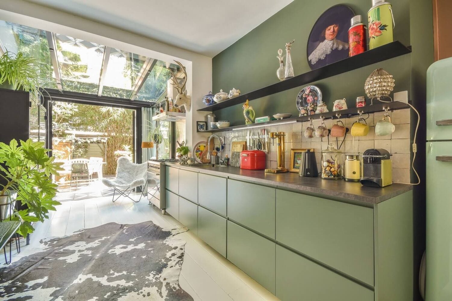 A Bright Colorful Home in Amsterdam 6 green-kitchen-cabinets-open-shelf-colorful-home-amsterdam-nordroom