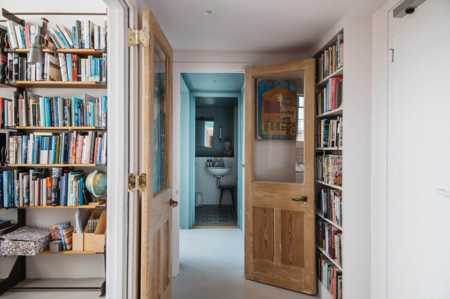 A Loft-Style Apartment with Brick Walls in London 13 hallway-london-apartment-brick-walls-bookshelves-nordroom