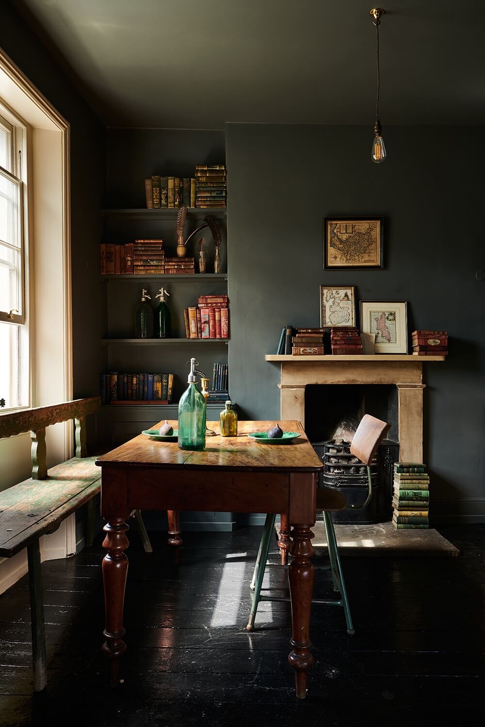 A Paint Job Transformed This deVOL Kitchen 13 kitchen-dining-area-bench-stone-fireplace-dark-gray-walls-ceiling-nordroom