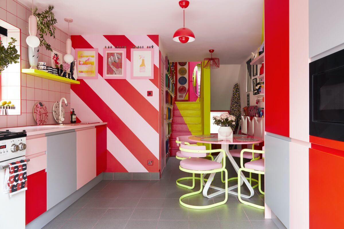A Quirky London Home Decorated with Neon Colors 5 kitchen-red-pink-triped-wall-nordroom