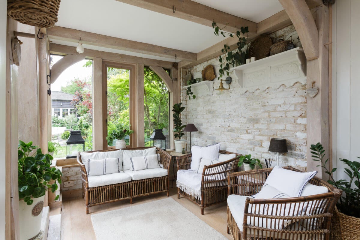A Cozy Cottage-Style Country House with a Lovely Garden 8 light-bohemian-conservatory-brick-walls-nordroom