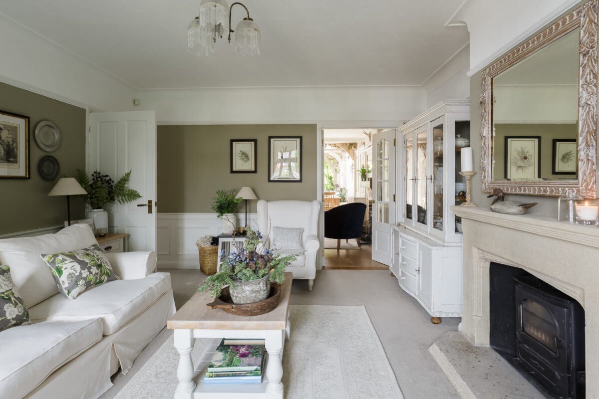 A Cozy Cottage-Style Country House with a Lovely Garden 12 light-cottage-style-sitting-room-fireplace-nordroom