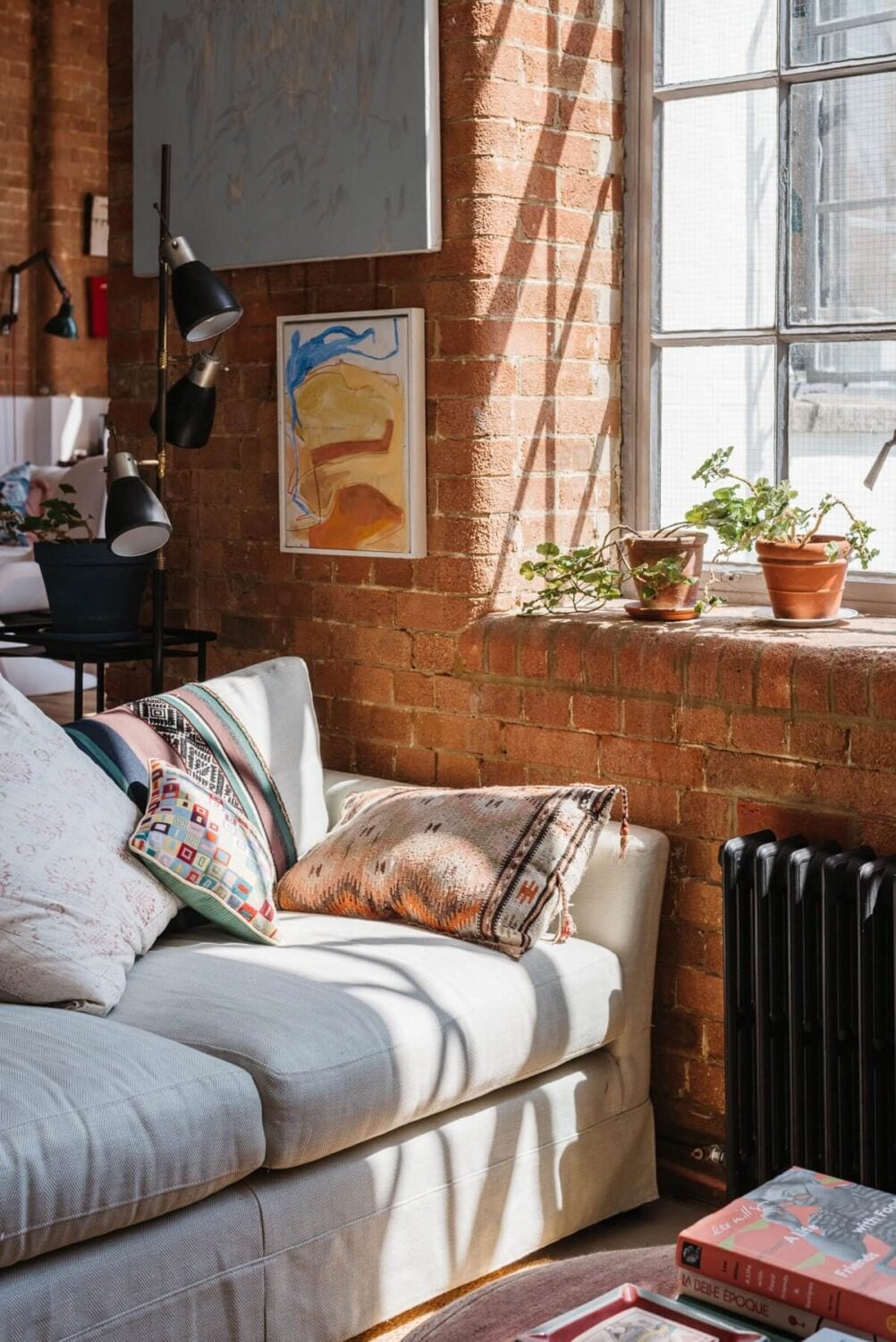 A Loft-Style Apartment with Brick Walls in London 3 living-room-exposed-brick-walls-natural-light-nordroom