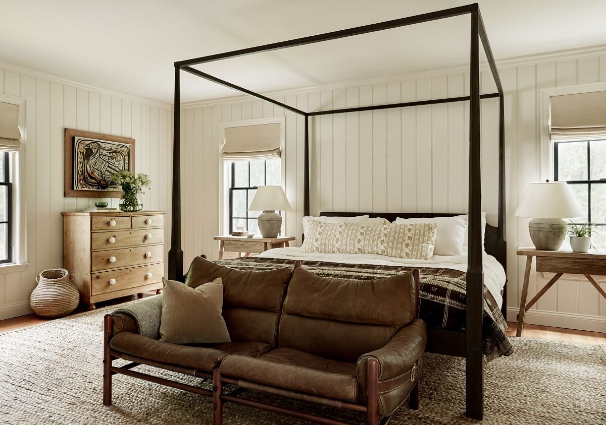 A Bedford Colonial Decorated in Warm Neutrals 8 master-bedroom-canopy-bed-leather-sofa-nordroom