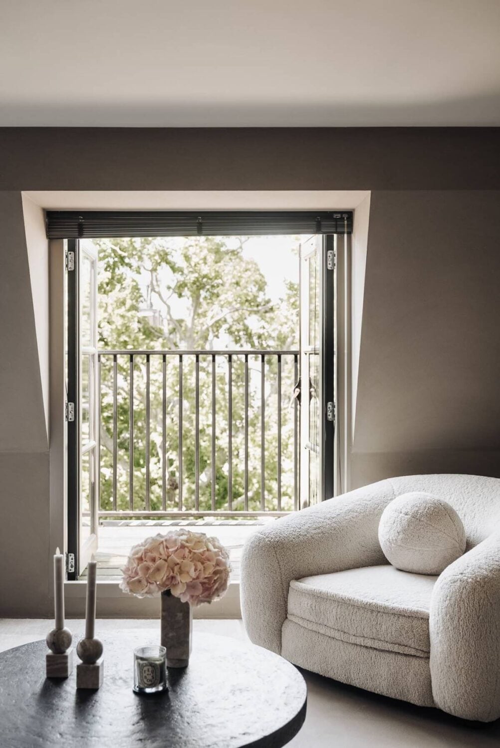 Light Gray Design Apartment in Amsterdam 17 master-bedroom-seating-balcony-nordroom