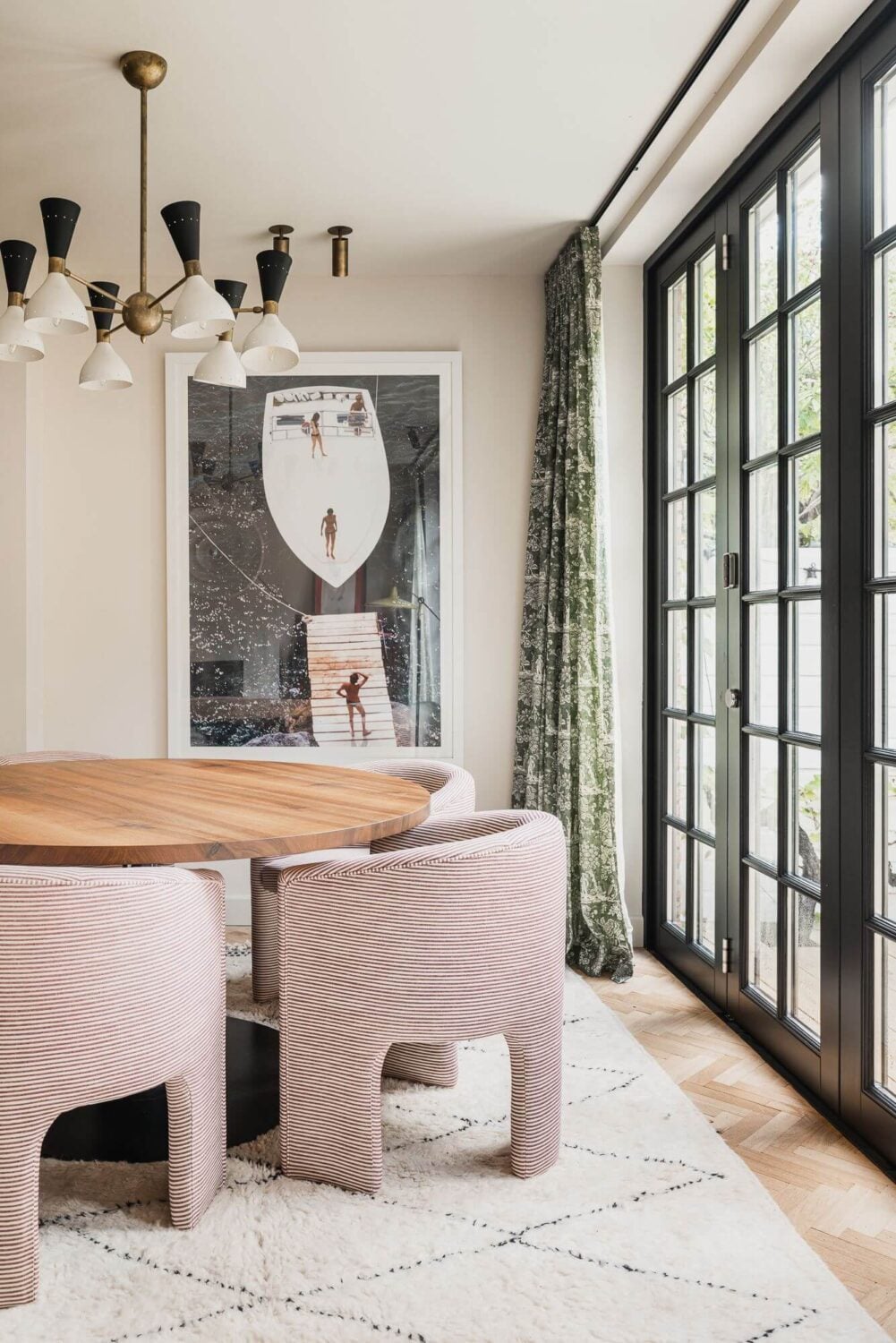 Color and Wallpaper in a Stylish Amsterdam Home 8 modern-dining-area-round-table-chandelier-nordroom
