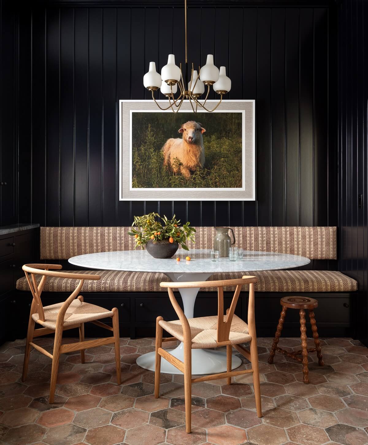 Pink Tones and Black in a Stunning Fox Island Home 8 moody-black-breakfast-nook-oval-dining-table-nordroom