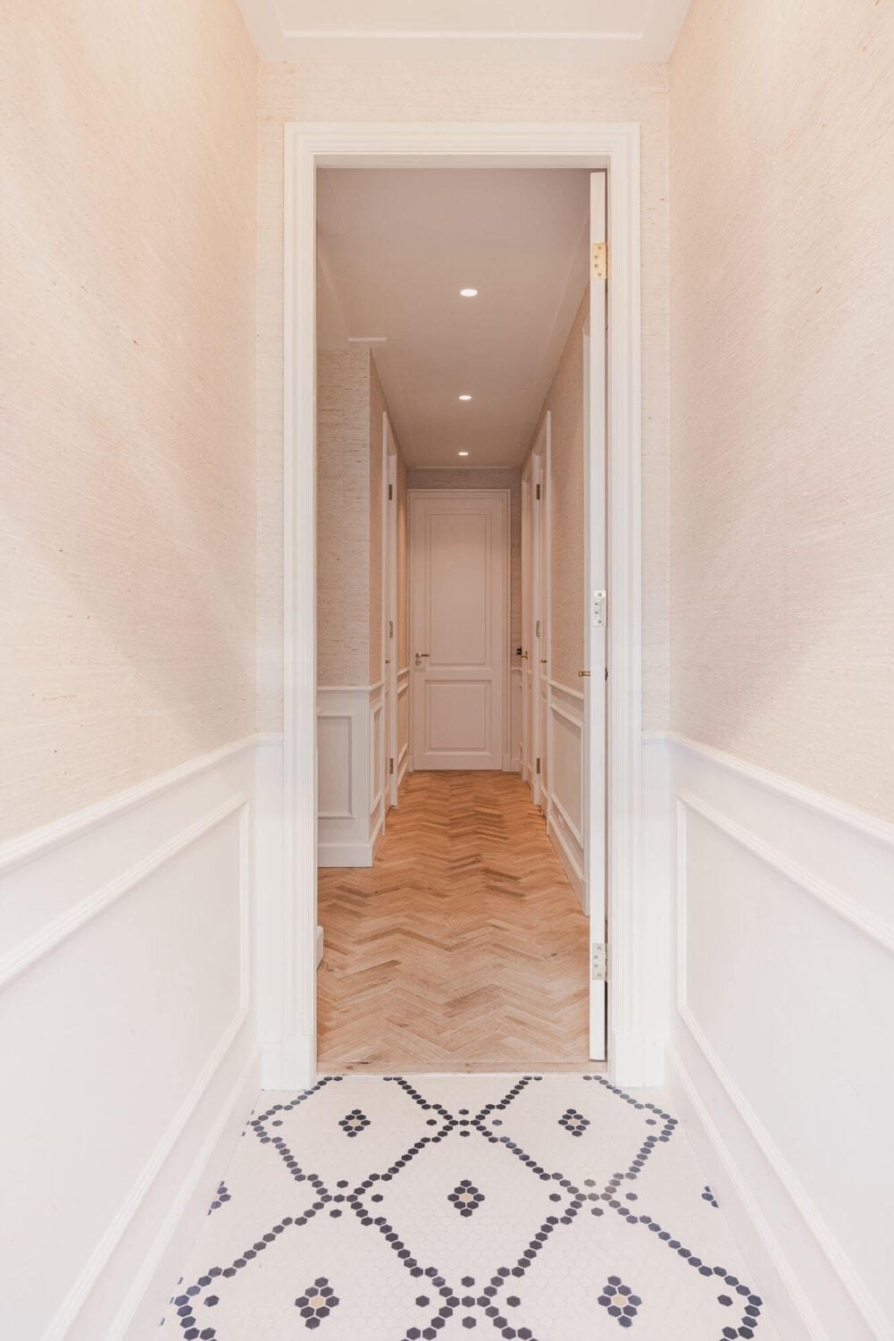 Color and Wallpaper in a Stylish Amsterdam Home 21 narrow-white-hallway-floor-tiles-nordroom