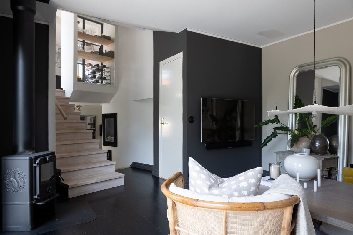 A Monochrome Nordic Home with Cozy Courtyard 3 open-plan-sitting-room-black-wall-nordroom