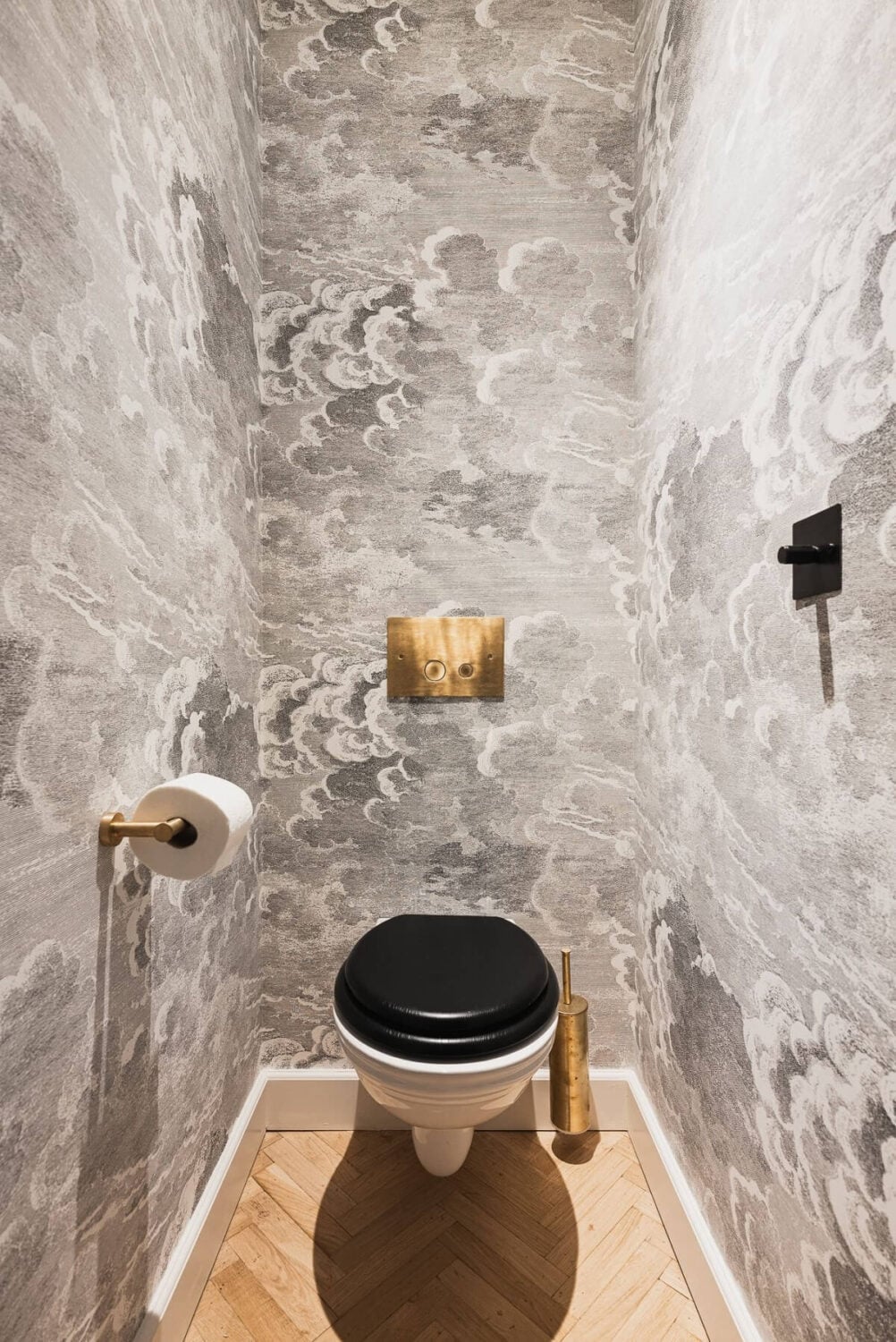 Color and Wallpaper in a Stylish Amsterdam Home 20 powder-room-cole-and-son-cloud-wallpaper-nordroom