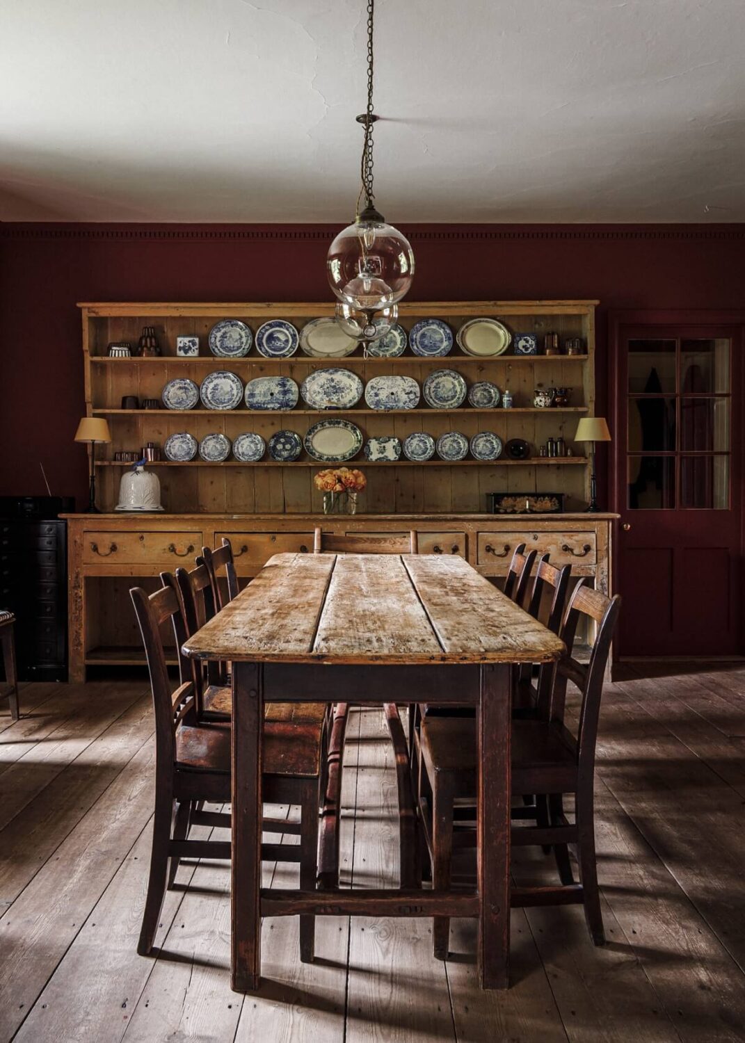 A Cozy Restored Country House in England 7 rustic-dining-table-red-walls-nordroom