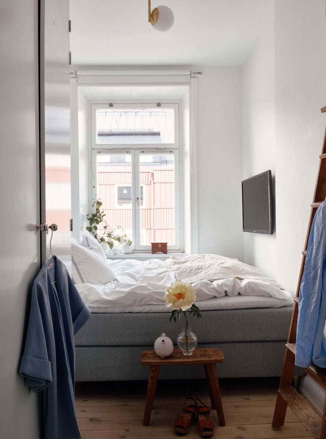 A Small Swedish Apartment with Ochre Yellow Sofa 13 small-narrow-white-bedroom-nordroom