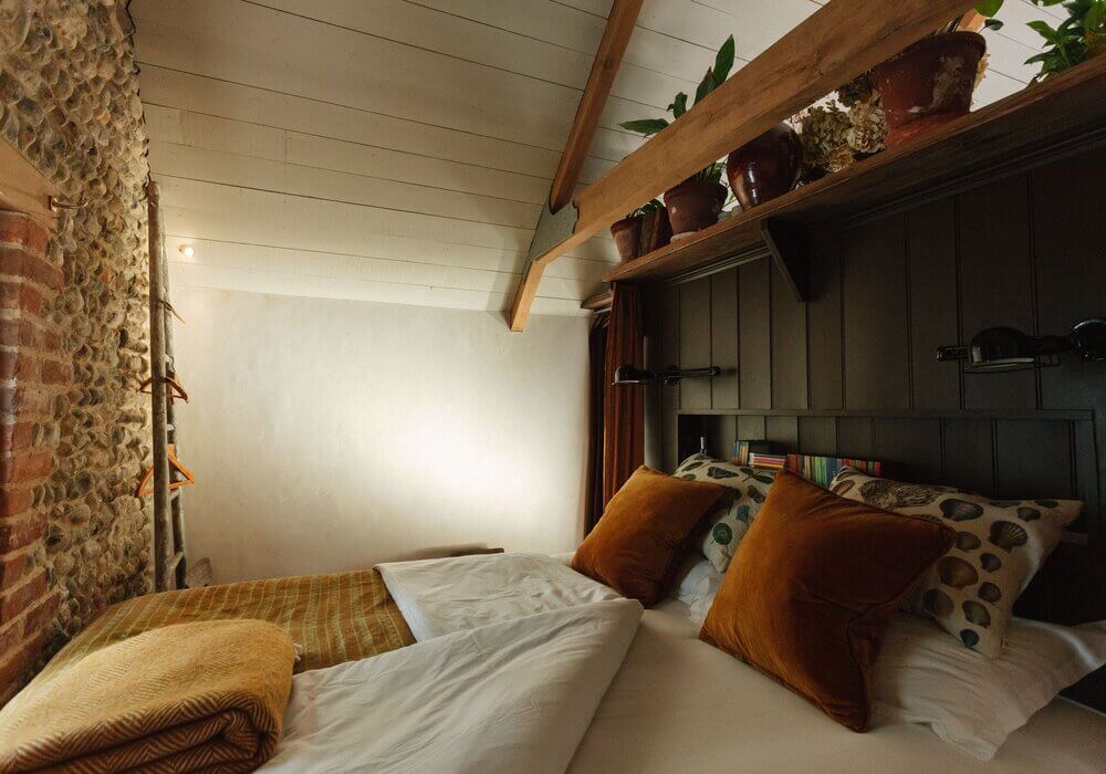 Spinks Nest: A Small Vintage Cottage in England 19 tiny-bedroom-exposed-brick-wall-vintage-cottage-england-nordroom