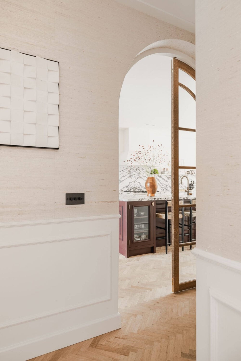 Color and Wallpaper in a Stylish Amsterdam Home 10 white-hallway-arched-doorway-kitchen-nordroom